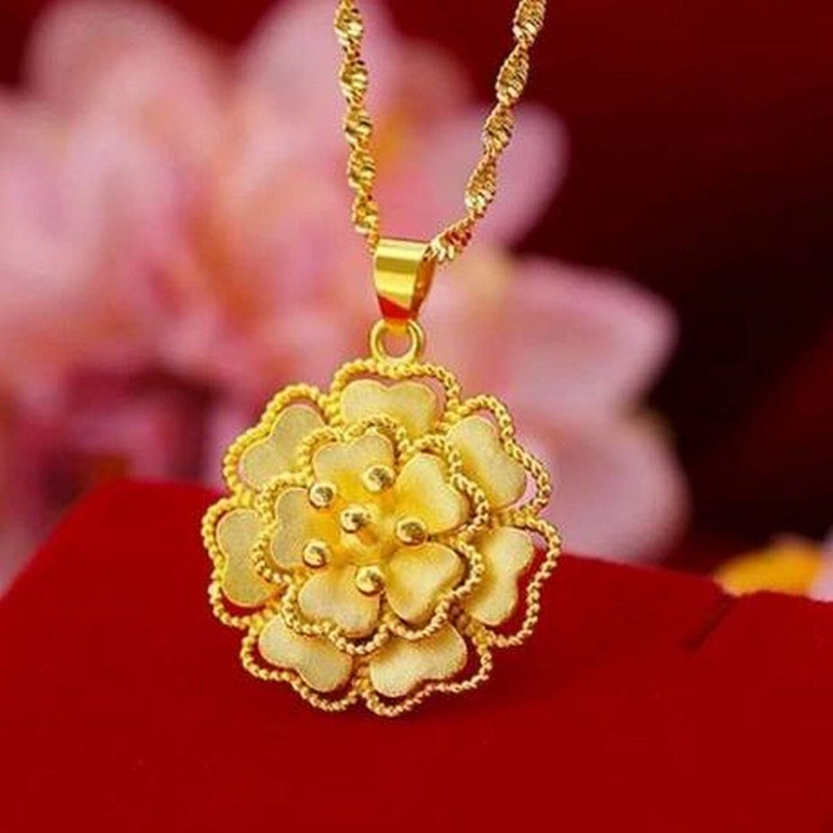 Gold chain with flower on sale pendant