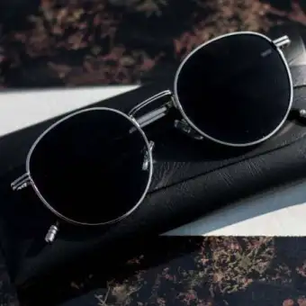 black lens round sunglasses