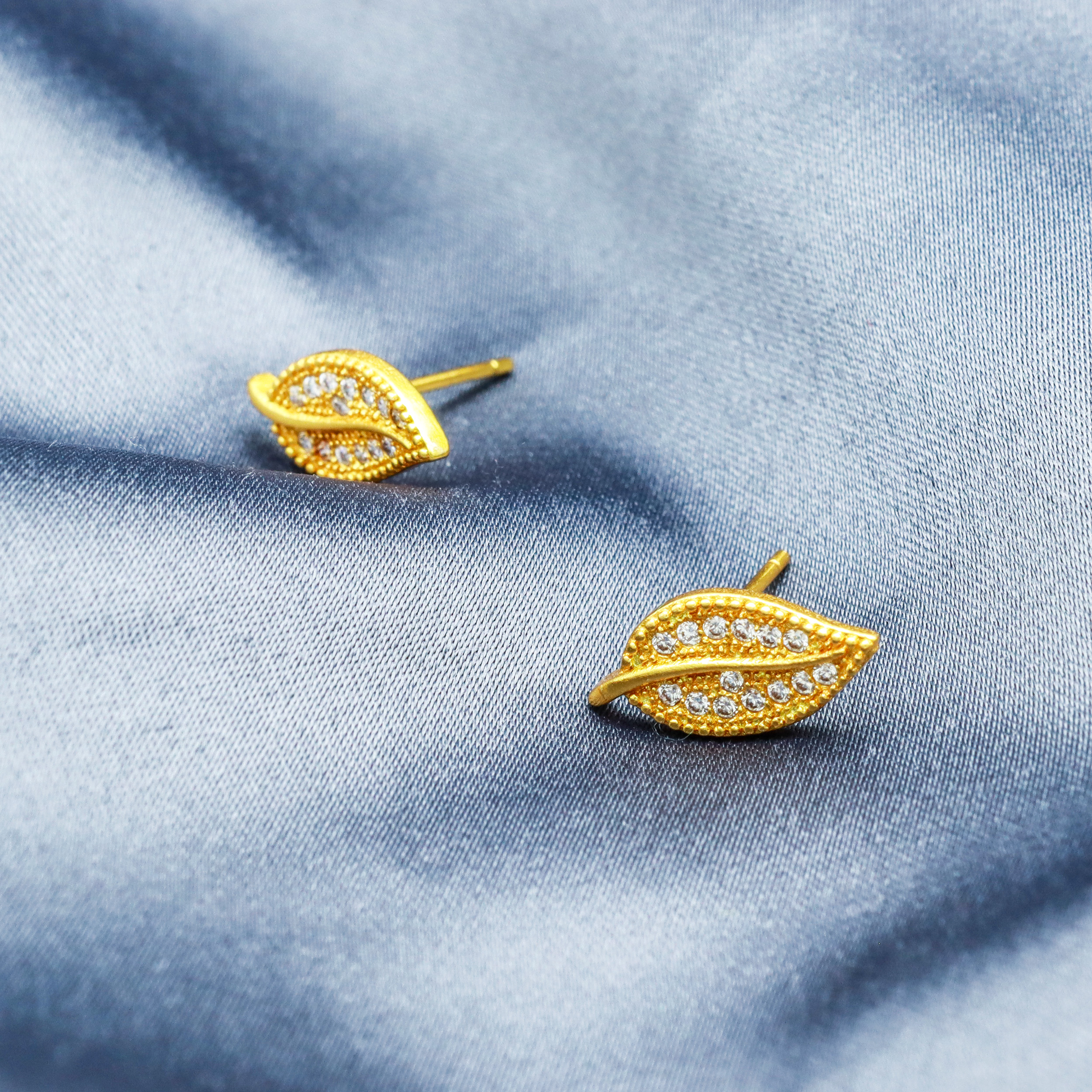 Gold stud earrings hot sale leaf design